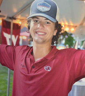 Nate in a polo and hat